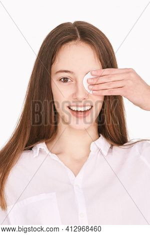 Pretty Girl Indoor Portrait. Light Background. Female Teenager Person. Long Brow Hair. Cleansing Dir