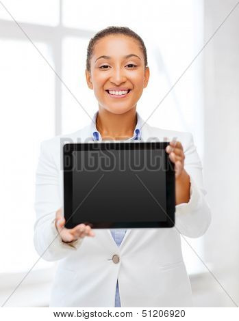 office, business, technology and internet concept - businesswoman with tablet pc in office