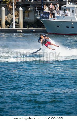 Unidentfied man demonstrates flyboard acrobatics in Long Beach
