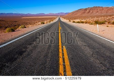 Never ending road to Death Valley California sunny desert