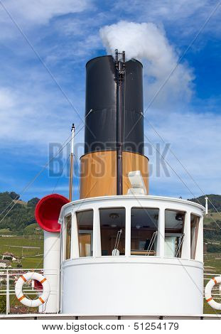 Vintage steam boat near the pier on the lake Leman (Switzerland)