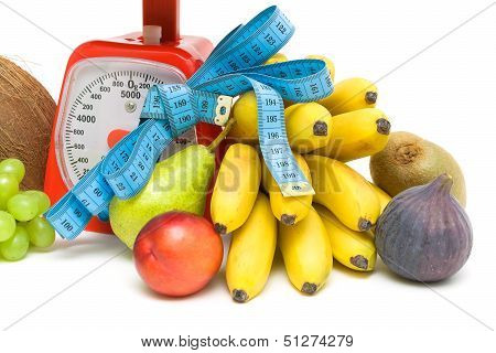 Fruit, Kitchen Scales And Measuring Tape Close Up. White Background.