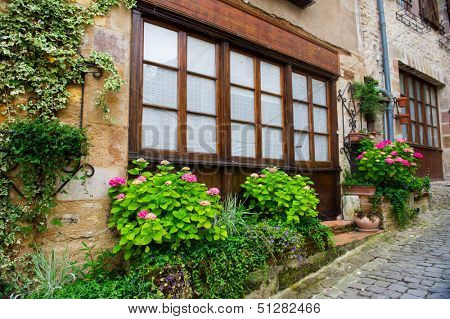 House with flowers in front at French Cordes sur ciel