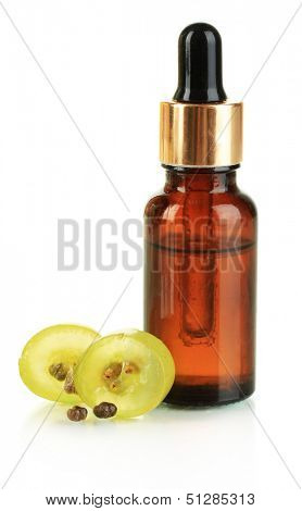 Ripe sliced grape and grapeseed oil, isolated on white