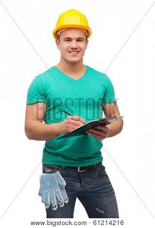 repair, construction and maintenance concept - smiling man in helmet with clipboard