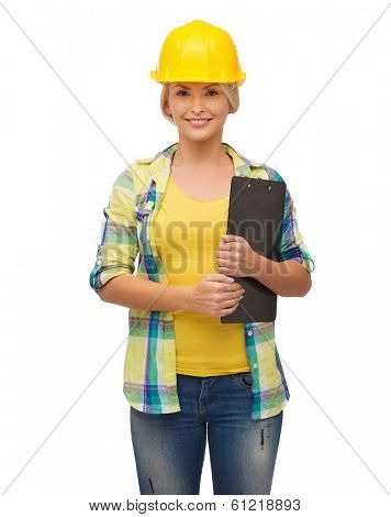 repair, construction and maintenance concept - smiling woman in helmet with clipboard