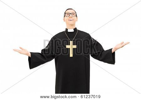 Young male priest looking up isolated on white background