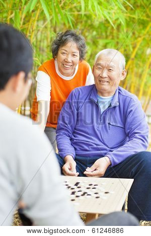 Male Seniors Win A Chinese Board Game .