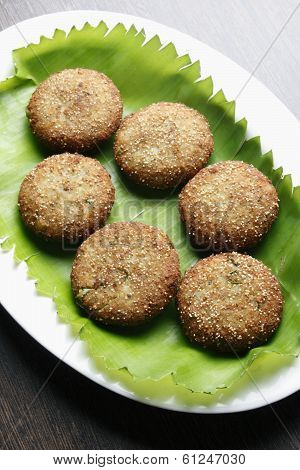 Narkel Posto Bora - A Bengali dish