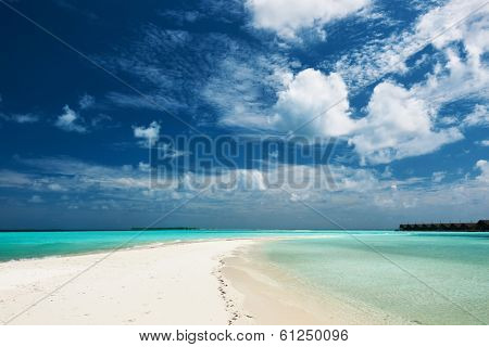 Beautiful island beach with sandspit at Maldives