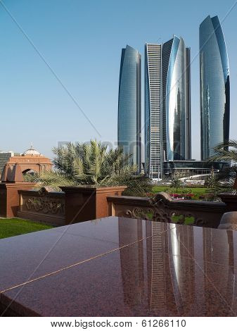 Futuristic Skyscrapers In Front Ofa Luxury Emirates Palace Hotel