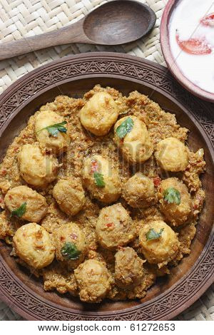Kashmiri dum aloo is a deep fried baby potatoes cooked in yogurt