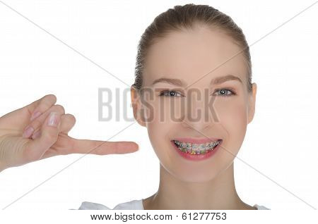 Smiling Happy Girl Indicates Braces On Teeth