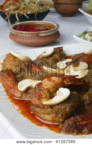 Narkel chingri, a prawn dish from India