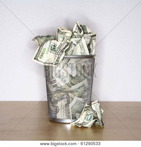hundred dollar bills in trash bin 