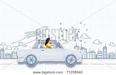 Young woman riding car made of list of paper