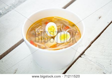 Chicken Soup With Noodles And Boiled Eggs