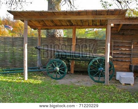 The Green Cart Under Wooden Canopy