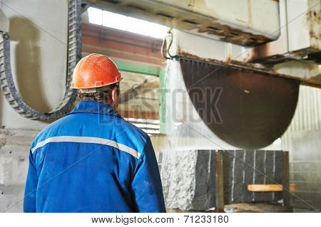 industrial worker at factory on granite or marble manufacture