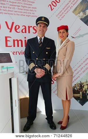 Emirates Airlines pilot and flight attendant at the Emirates Airlines booth at the US Open 2014