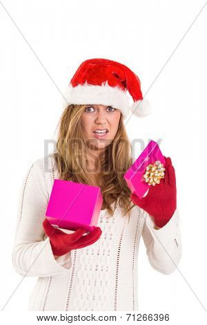 Festive blonde opening a gift on white background
