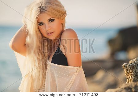 Beautiful young woman relaxing on the beach