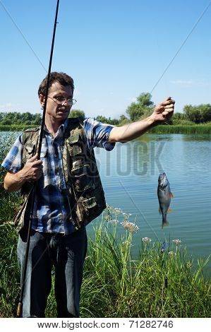 Fisherman With Perch On River Chagan