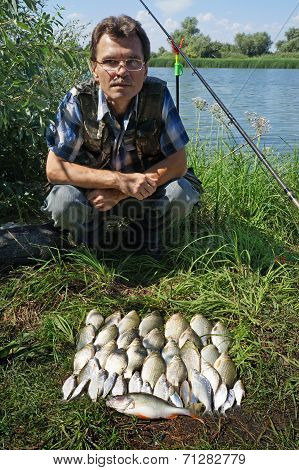 Fisherman With Crucian On River Chagan