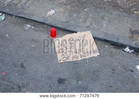 Lament sign left behind with cup