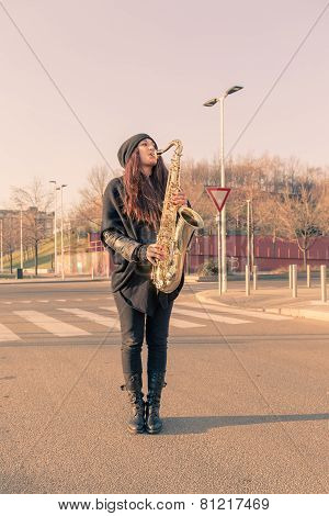 Beautiful Young Woman Playing Tenor Saxophone
