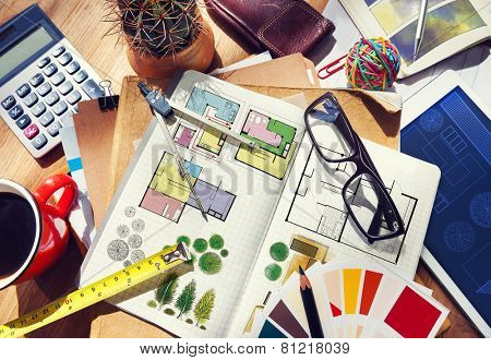 Messy Designer's Table with Project Plan and Tools