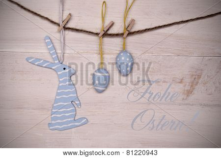 Blue Easter Bunny And Easter Eggs Hanging On Line With German Happy Easter