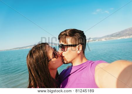 Couple In Love Taking Self-portrait On Beach