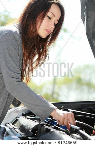 Young Woman Try To Fix Engine Problem Of Her Car