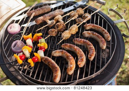 Fresh meat and vegetables on outdoor grill