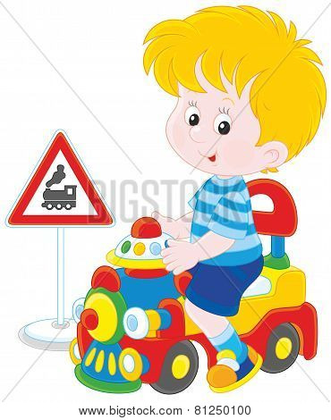Boy on a toy train