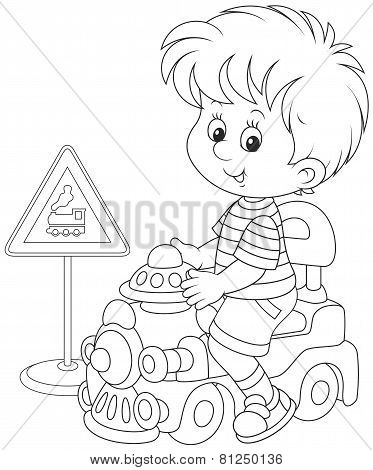 Boy on a toy train