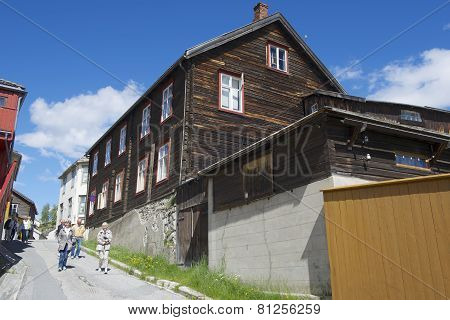 Tourists explore street of Roros in Roros, Norway.