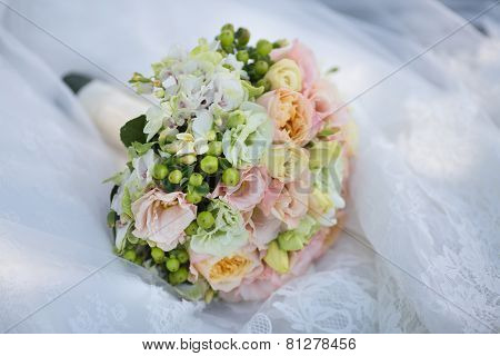Wedding Bouquet on Bride's Dress
