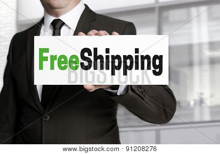 Freeshipping Sign Is Held By Businessman