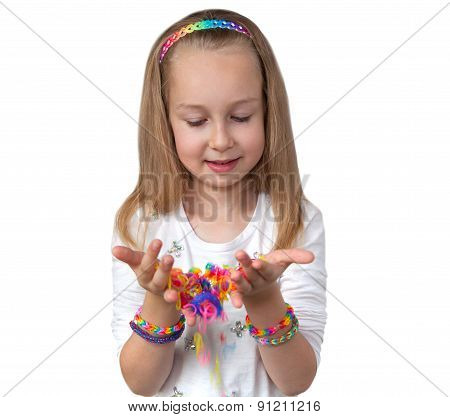 Loom bands craft. Little girl holding colourful loom in her hands
