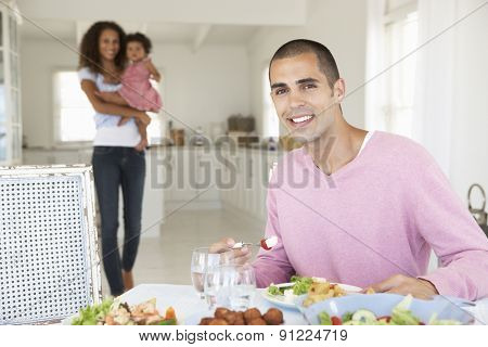 Family Enjoying Meal Together At Home