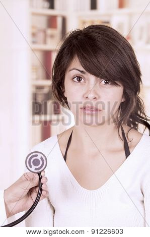 Beautiful young girl looking nervous at the doctor's appointment