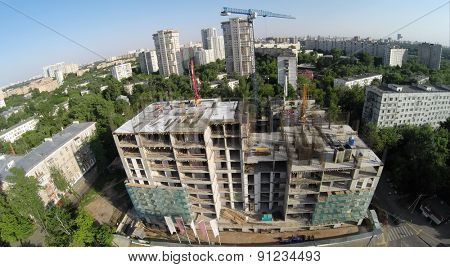 Building material lay on construction site of residential complex at spring sunny day. Aerial view