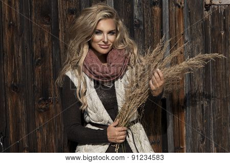 Young Girl Smiling In Autumn Scenery