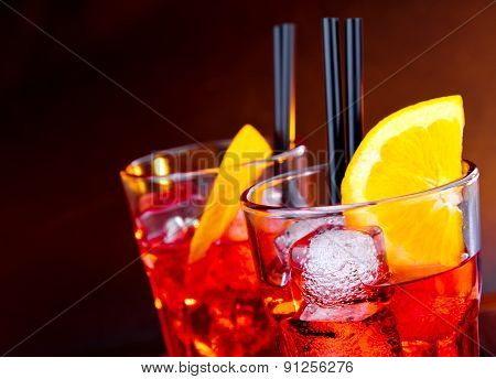 Close-up Of Two Glasses Of Spritz Aperitif Aperol Cocktail With Orange Slices And Ice Cubes