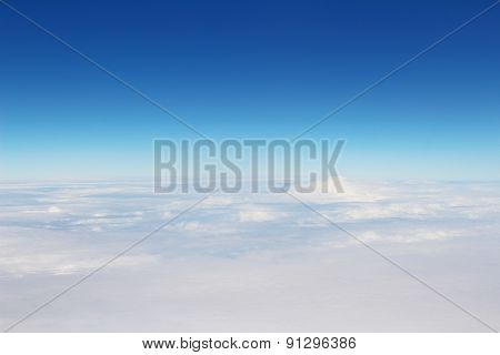 Aerial View Of Blue Sky And Cloud Top View From Airplane Window