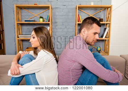 Angry couple looking at different directions  after a hard quarrel