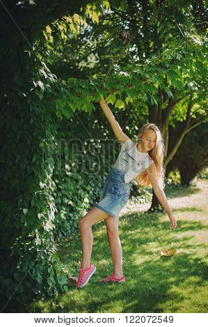 Portrait of yong pretty beautiful girl with long blond hair in soft sunny colors near tree.
** Note: Soft Focus at 100%, best at smaller sizes
