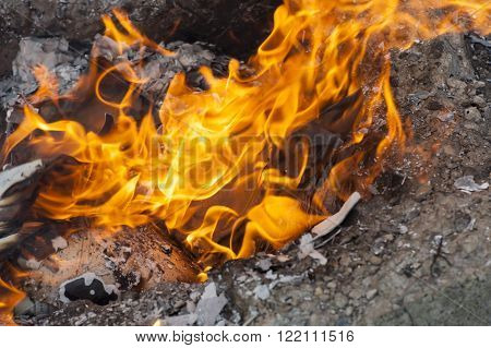 Burning office white paper in bonfire outside